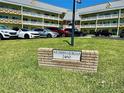 Close up of the Southern Georgian signage at 2460 in front of the building, with green lawn at 2460 Canadian Way # 36, Clearwater, FL 33763