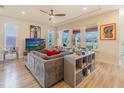 Comfortable living room featuring large windows, modern decor, and abundant natural light at 28923 Lucero Ln, Wesley Chapel, FL 33543