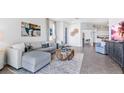 Bright living room with a comfortable sectional, stylish decor, and modern accents at 3701 Stormy Thistle Pl, Plant City, FL 33565