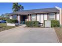 Charming single-story home with well-maintained landscaping and a cozy front patio area at 3914 41St W St, Bradenton, FL 34205