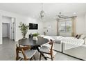 Stylish dining area with modern table and chairs, and lots of natural light at 4036 56Th N Ave, St Petersburg, FL 33714