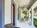 Inviting front porch with classic columns, offering a relaxed seating area and neighborhood views at 6002 Churchside Dr, Lithia, FL 33547