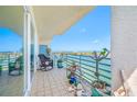 Open balcony with seating, plants, and amazing views of the water at 7932 Sailboat Key S Blvd # 806, South Pasadena, FL 33707