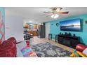 Bright living room featuring tile flooring, and a view of the kitchen at 9248 59Th N St, Pinellas Park, FL 33782