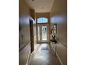 Inviting entryway with tile floors, decorative glass front door, and plenty of natural light at 9613 Jasmine Brook Crk, Land O Lakes, FL 34638