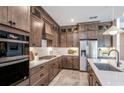 Modern kitchen with stainless steel appliances and a central island at 1672 Valier Pt, Zephyrhills, FL 33541