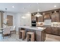 Modern kitchen with stainless steel appliances and a central island at 1672 Valier Pt, Zephyrhills, FL 33541