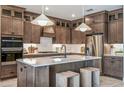 Modern kitchen with stainless steel appliances and a central island at 1672 Valier Pt, Zephyrhills, FL 33541