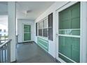 Inviting building entrance with muted, modern colors creates a welcoming first impression at 200 Glennes Ln # 201, Dunedin, FL 34698