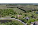 Aerial view showcasing the property's expansive lot, mature trees, and beautiful landscaping at 34201 Kentucky Derby Pl, Dade City, FL 33525