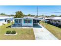 Charming mobile home with a covered porch and driveway, nestled in a peaceful and friendly community at 5306 Mary St, Zephyrhills, FL 33542
