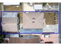 A bird's-eye view of the property showcasing its layout, yard space, and surrounding neighborhood at 6920 N Hubert Ave, Tampa, FL 33614