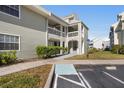 Exterior of condo building with accessible parking and covered balconies at 6923 Stones Throw N Cir # 4205, St Petersburg, FL 33710