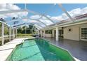 Inviting screened-in pool area perfect for relaxation and outdoor enjoyment, with a nice view at 6968 De Brita Rd, North Port, FL 34291
