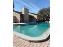 Inviting community pool with lounge chairs and well-maintained surroundings at 7526 Needle Leaf Pl # 30, Tampa, FL 33617