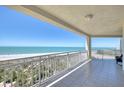 Spacious tiled balcony offers panoramic views of the pristine beach and turquoise waters at 1180 Gulf Blvd # 1201, Clearwater, FL 33767