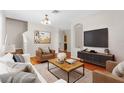 Comfortable living room with stylish decor, hardwood floors, and ample space for entertaining at 200 Fairmont Dr, Spring Hill, FL 34609
