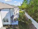 A view of the home's backyard, showcasing the patio and fenced-in yard at 4326 Banjo Lake Rd, Land O Lakes, FL 34639