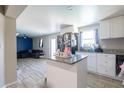 Open kitchen with granite countertops, white cabinets, and stainless steel appliances at 724 Tradewinds Dr, Brandon, FL 33511