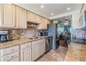 Well-equipped kitchen featuring stainless steel appliances and a tile backsplash at 2700 Cove Cay Dr # 5-G, Clearwater, FL 33760