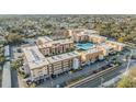 A condo complex features a pool, tennis courts, parking, and easy access to surrounding community at 5820 N Church Ave # 148, Tampa, FL 33614