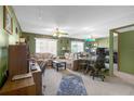 Inviting living room featuring carpet, natural light and ceiling fan at 5820 N Church Ave # 148, Tampa, FL 33614