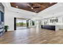 Spacious open floor plan with hardwood floors and access to the pool at 9514 Snapper Cir, Port Charlotte, FL 33981