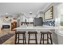 Eat-in kitchen features a breakfast bar with seating and modern finishes at 1653 S Prescott Ave, Clearwater, FL 33756