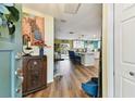 Inviting foyer with views of the open kitchen and an attractive hardwood floor at 1887 Oak Forest E Dr, Clearwater, FL 33759