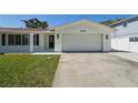 Charming single-story home with a well-kept lawn, attached garage and inviting curb appeal at 2650 E Vina Del Mar Blvd, St Pete Beach, FL 33706