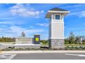 Welcome to Persimmon Park at Boggy Branch entrance sign and community watch tower at 28842 Hillcrest Valley Blvd, Wesley Chapel, FL 33543