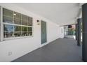 Inviting front porch showcasing a decorative door and window allowing ample natural light at 2930 W Arch St, Tampa, FL 33607