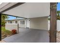 Carport showing close access to front door at 5103 Town N Country Blvd, Tampa, FL 33615