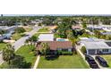 Charming single-story home with a well-manicured lawn, mature trees, and a convenient driveway at 1101 39Th Ne Ave, St Petersburg, FL 33703