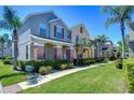 Well-maintained townhouses with manicured lawns, brick accents and mature landscaping at 12646 Carlby Cir, Tampa, FL 33626