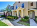 Well-maintained multi-Gathering home showcasing a welcoming facade, lush shrubbery, and manicured lawn at 12646 Carlby Cir, Tampa, FL 33626