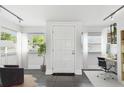 Bright entryway with a white door and tile floors, offering a welcoming first impression at 1401 E North St, Tampa, FL 33604