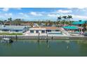 Waterfront home featuring pool, dock, and canal access for boating enthusiasts at 1507 Sea Gull S Dr, St Petersburg, FL 33707