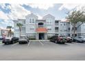 Charming condo building featuring a well-maintained facade with private balconies and ample parking at 18001 Richmond Place Dr # 1032, Tampa, FL 33647