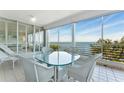 Relaxing patio area with comfortable seating and panoramic water views perfect for entertaining at 2410 Harbourside Dr # 142, Longboat Key, FL 34228