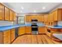 Well-lit kitchen boasting wooden cabinets, stainless steel appliances, a subway tile backsplash, and blue countertops at 3124 9Th N Ave, St Petersburg, FL 33713