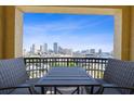 Relaxing balcony view with table set and city skyline, perfect for enjoying coffee at 345 Bayshore Blvd # 1502, Tampa, FL 33606