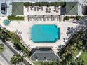 Aerial view of community pool and lounge chairs at 345 Bayshore Blvd # 1502, Tampa, FL 33606