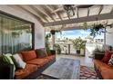 Inviting covered porch with comfortable seating and views of the water at 350 Pinellas Bayway S # 2, St Petersburg, FL 33715
