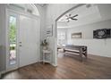 Bright entryway showcasing wood-look tile flooring and view to bonus room/dining at 3633 Cordgrass Dr, Valrico, FL 33596