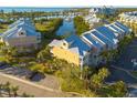 Exterior aerial view of waterfront condominiums with balconies, palm trees, parking, and lovely bay views at 418 Bahia Beach Blvd, Ruskin, FL 33570