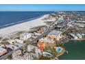 Stunning aerial view of the condo building near the beach and coastline, offering a desirable location at 10301 Gulf Blvd # 302, Treasure Island, FL 33706