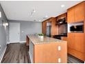 Open kitchen with stainless steel appliances and granite countertops at 1208 E Kennedy Blvd # 612, Tampa, FL 33602