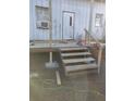 Exterior of home with weathered siding and wooden stairs at 16251 Us Highway 301, Dade City, FL 33523