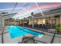 Enjoy the Florida lifestyle in this in-ground screened pool with ample patio space at 16808 Woburn Ln, Lutz, FL 33549